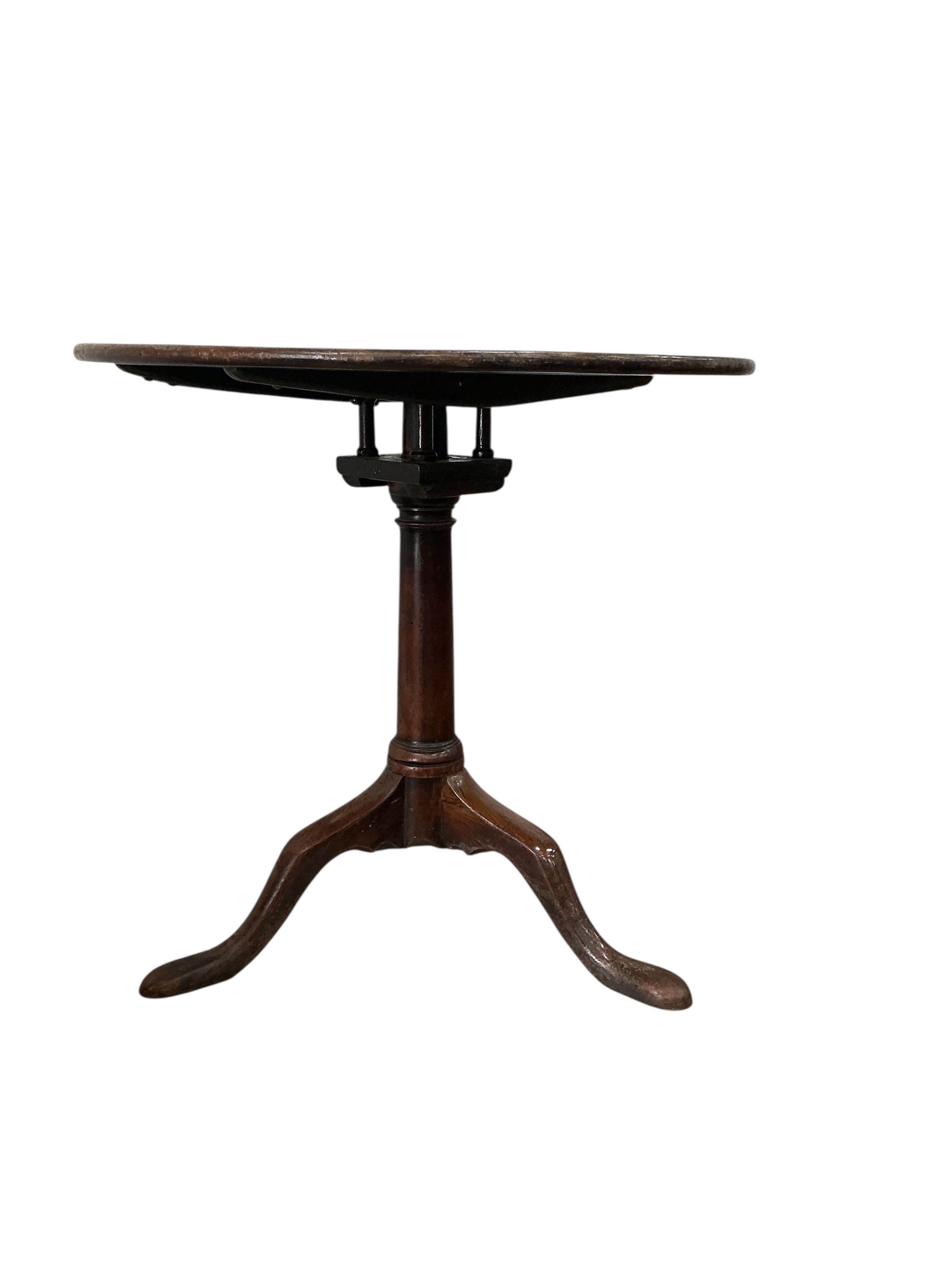 A George III circular mahogany tilt top birdcage tea table, diameter 69cm, height 65cm, reduced